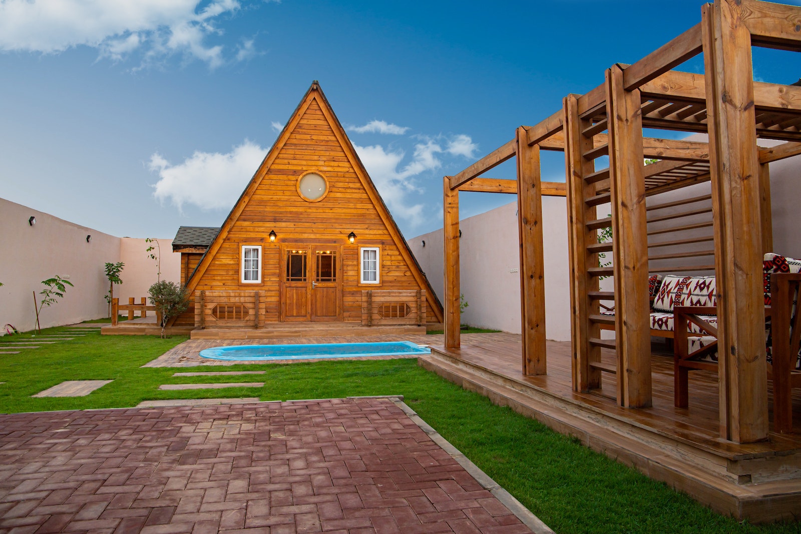 A Wooden A-frame House Near a Swimming Pool